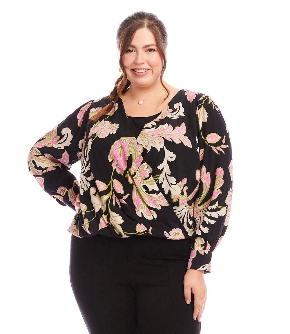 Plus size drape front top with chalk floral print and blouson cuffed sleeves on smiling woman