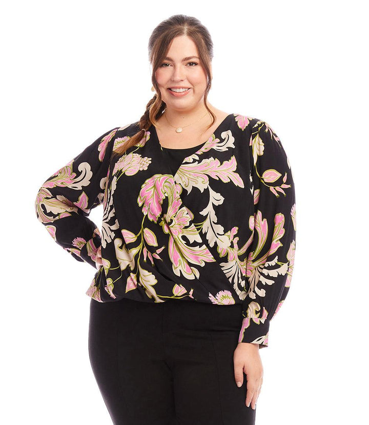 Plus size drape front top with chalk floral print and blouson cuffed sleeves on smiling woman