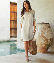 Linen shirtdress with roll-tab sleeves, front pocket, and relaxed fit in oatmeal linen