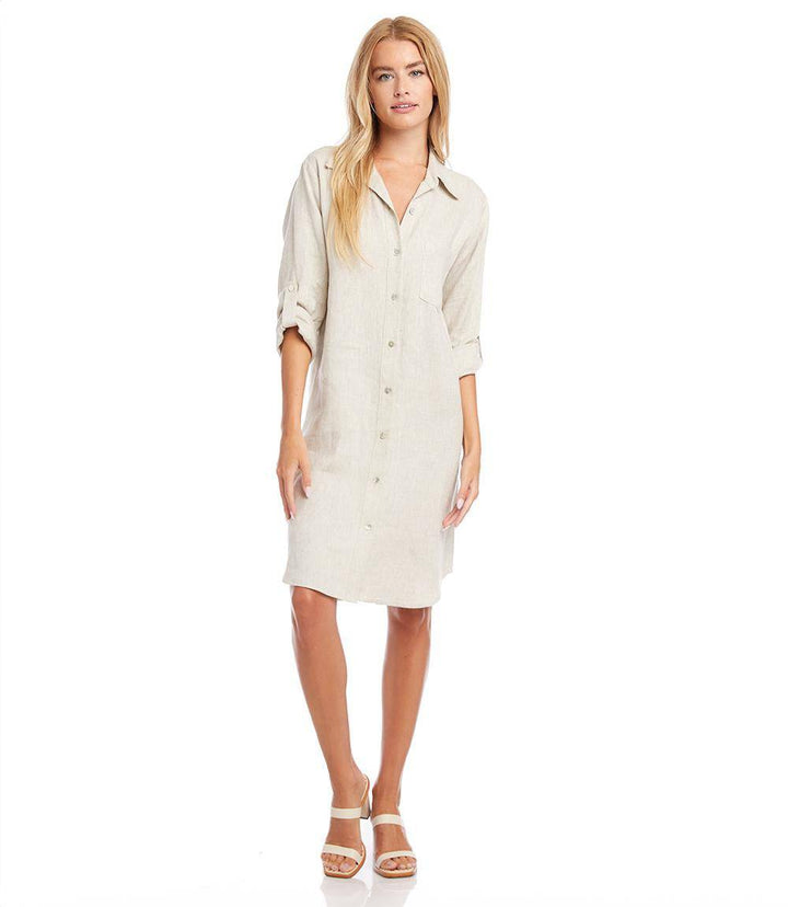 Petite size oatmeal linen shirtdress with roll-tab sleeves, front buttons, patch pocket, and relaxed fit.