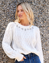white embellished sweater