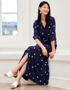 woman wearing blue top and matching skirt