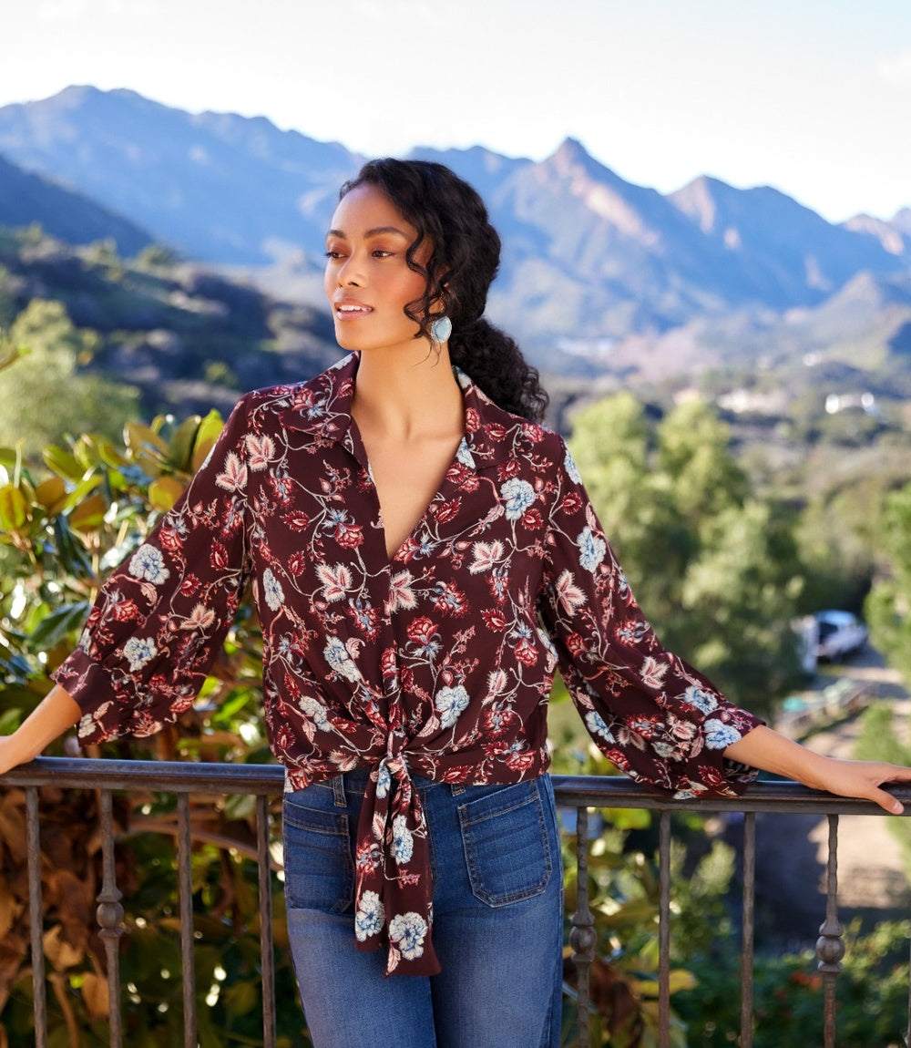 Blouson sleeve tie-front top in wine floral crepe with notched collar and gathered cuffs