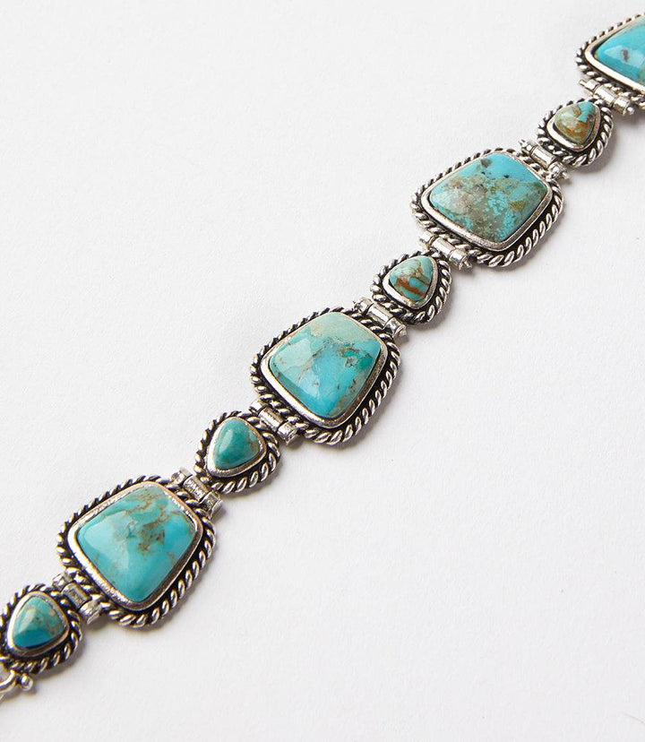 Handcrafted turquoise bracelet with sterling silver twisted wire rope and geometric turquoise stones, 8 inches long