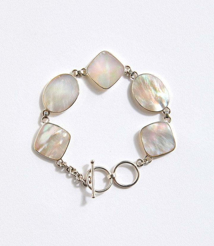 Sterling silver Mother of Pearl Station Bracelet with alternating mother of pearl stones and toggle closure