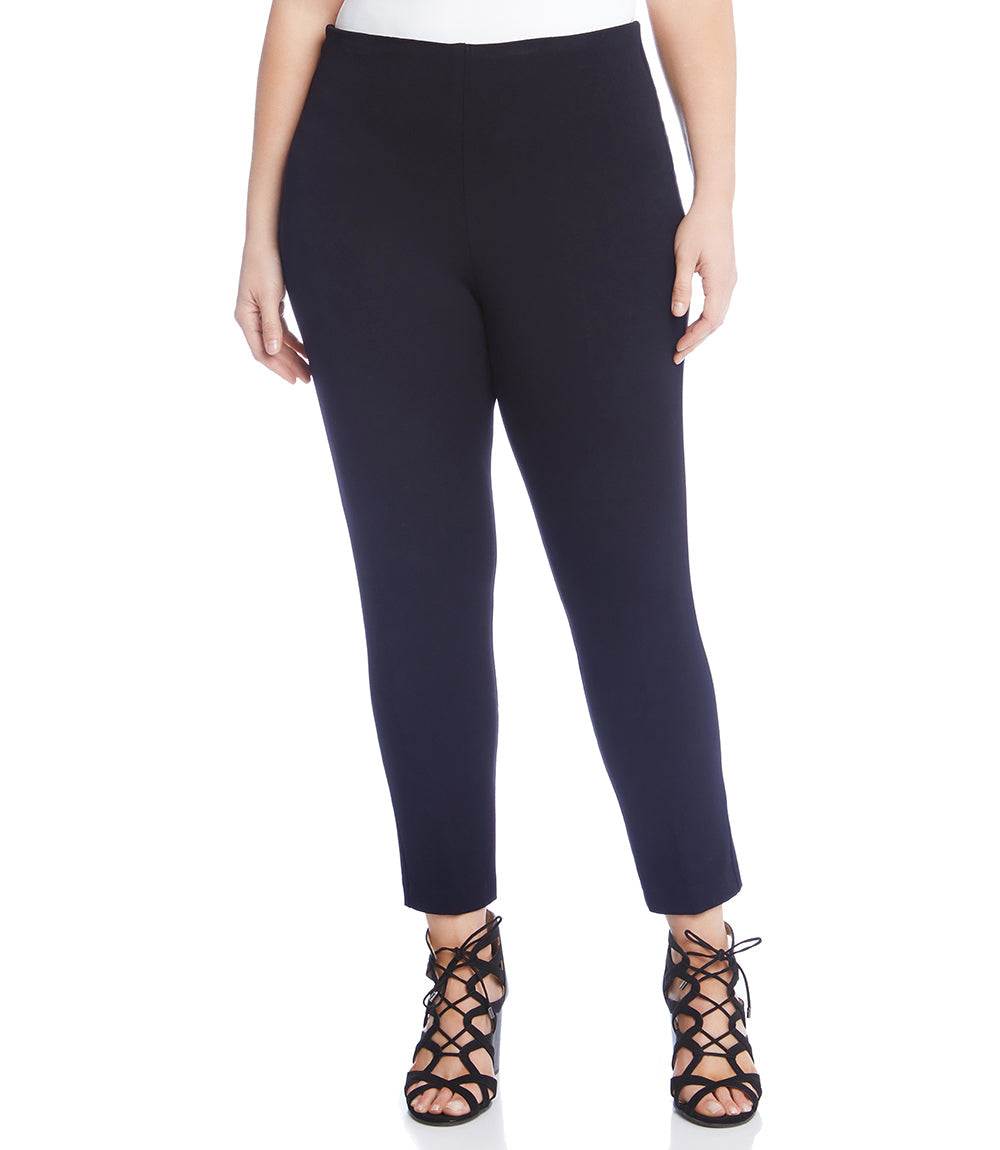 Plus size navy ankle-length Piper pants with cigarette fit and elastic waistband modeled with black lace-up heels