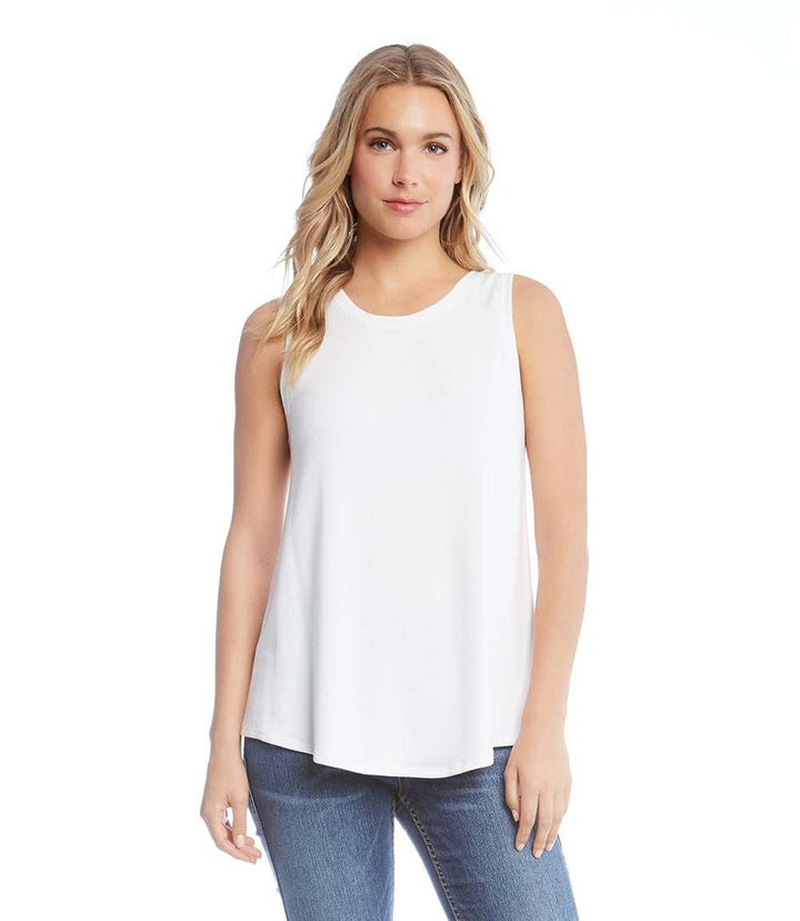 White relaxed fit tank top in soft French terry fabric with shirttail hem, worn with jeans